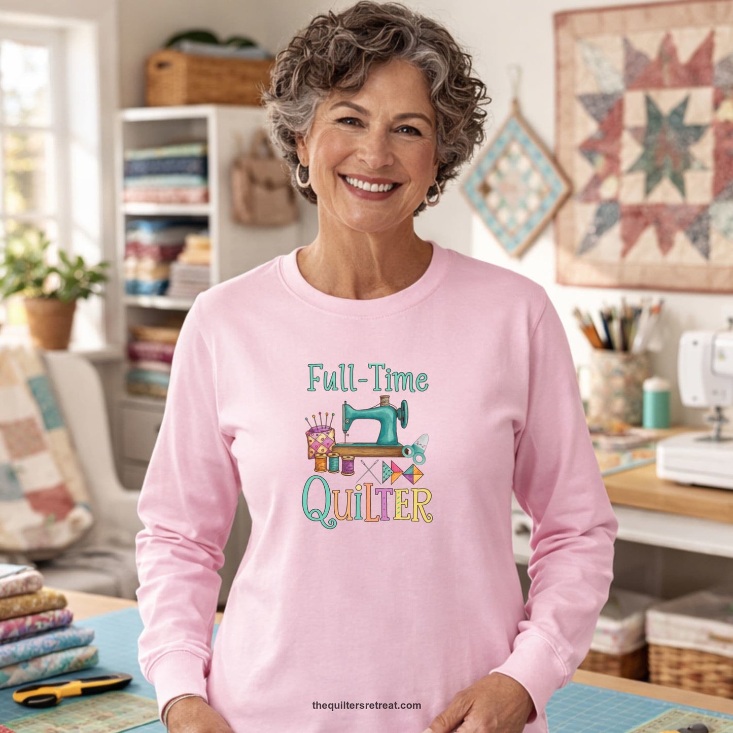 A Long Sleeve T-Shirt with a vintage sewing machine with colorful threads and "Full-Time Quilter" text in playful style