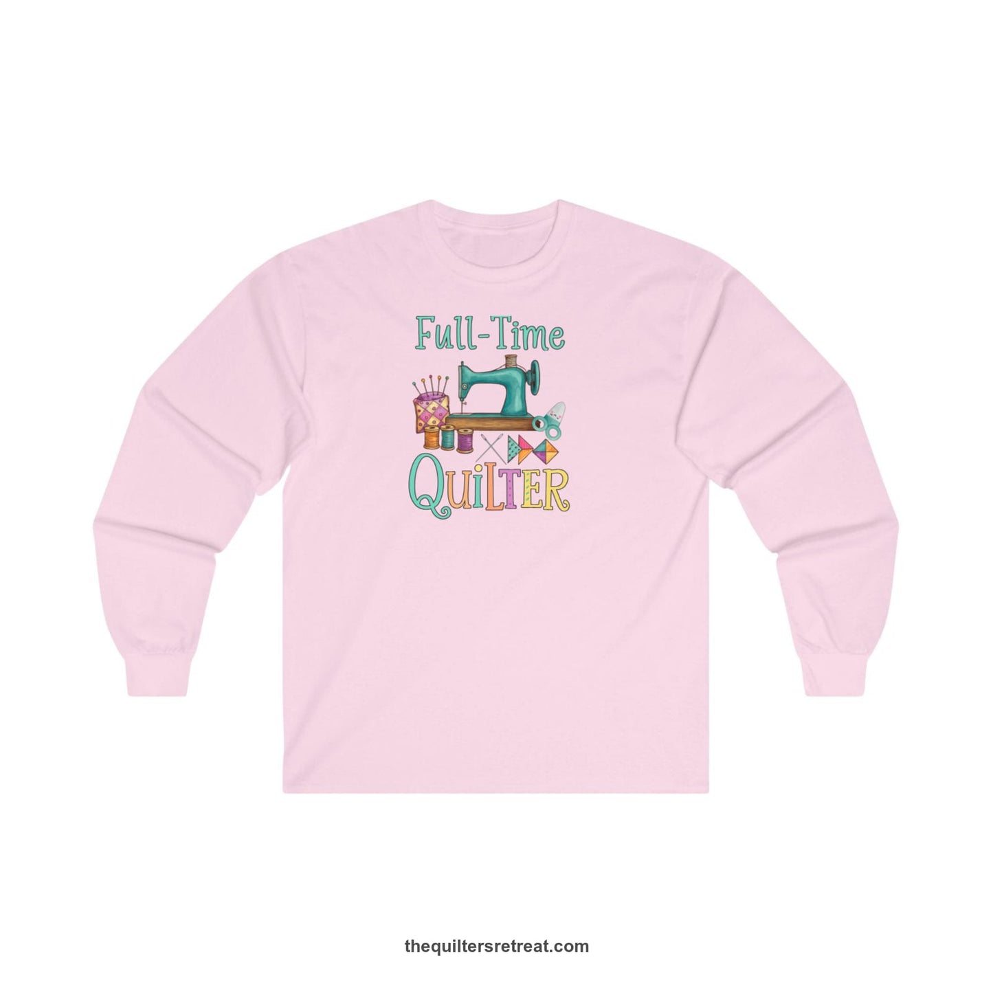 A Light Pink Long Sleeve T-Shirt with a vintage sewing machine with colorful threads and "Full-Time Quilter" text in playful style