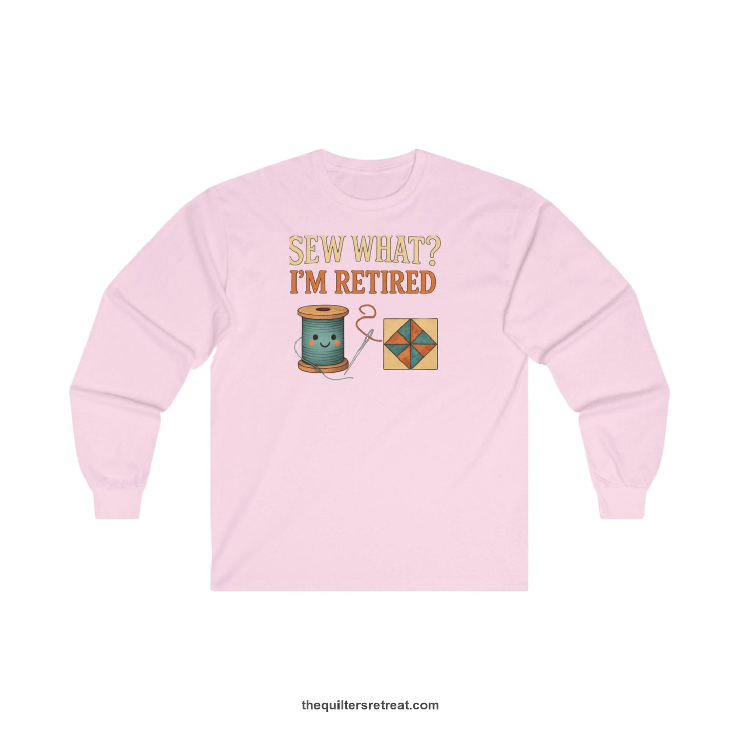 A Light Pink Long Sleeve T-Shirt with a funny "Sew What? I'm Retired" text with smiling spool and quilt block design