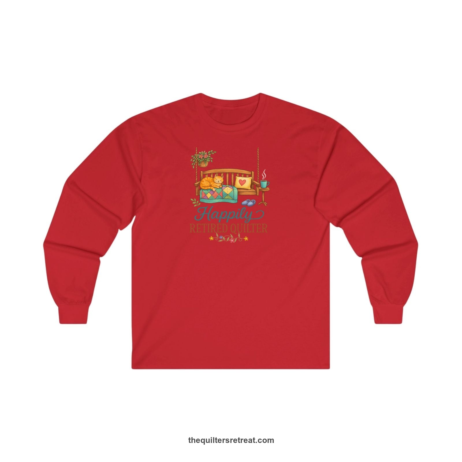 A Red Long Sleeve T-Shirt with a hanging bench with cozy cat and quilt, surrounded by plants, "Happily Retired Quilter" text