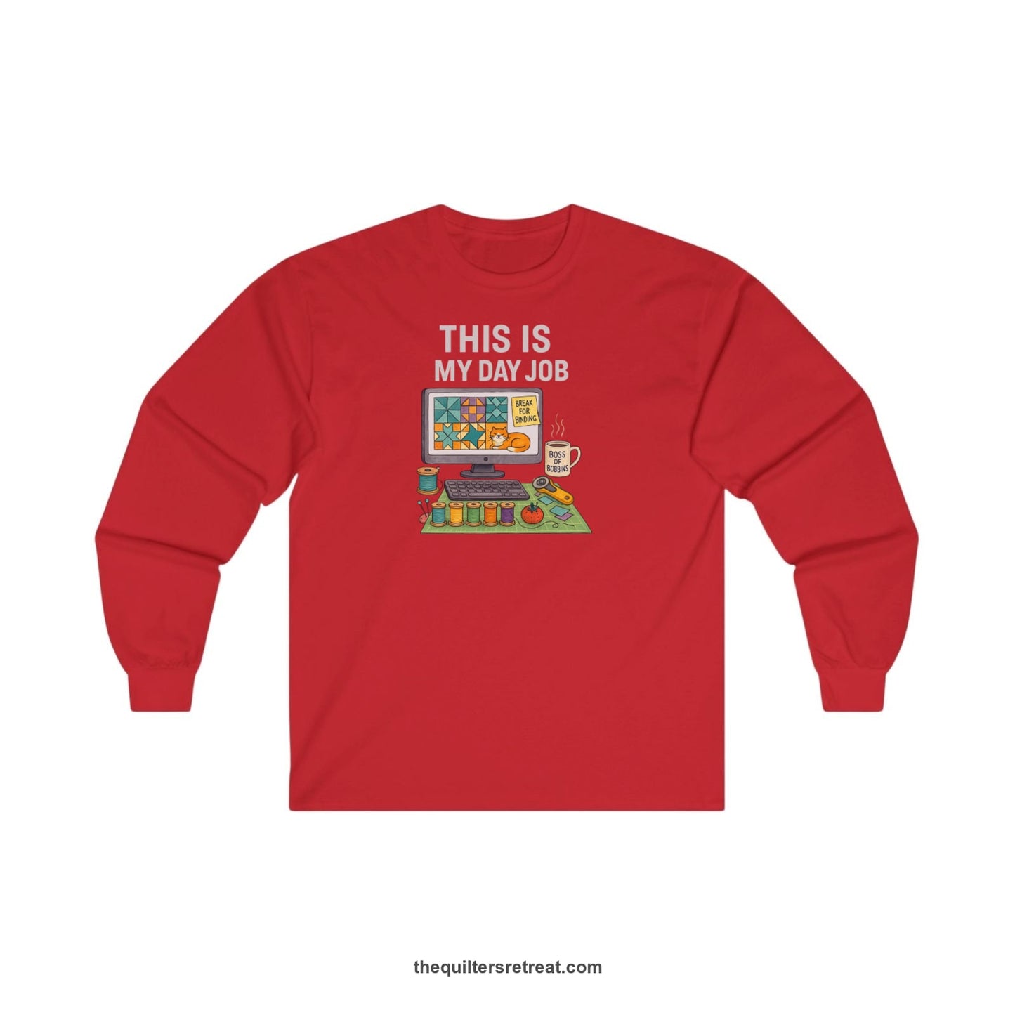 A Red Long Sleeve T-Shirt with a computer quilt design, cat illustration, "THIS IS MY DAY JOB" text with sewing tools, playful style