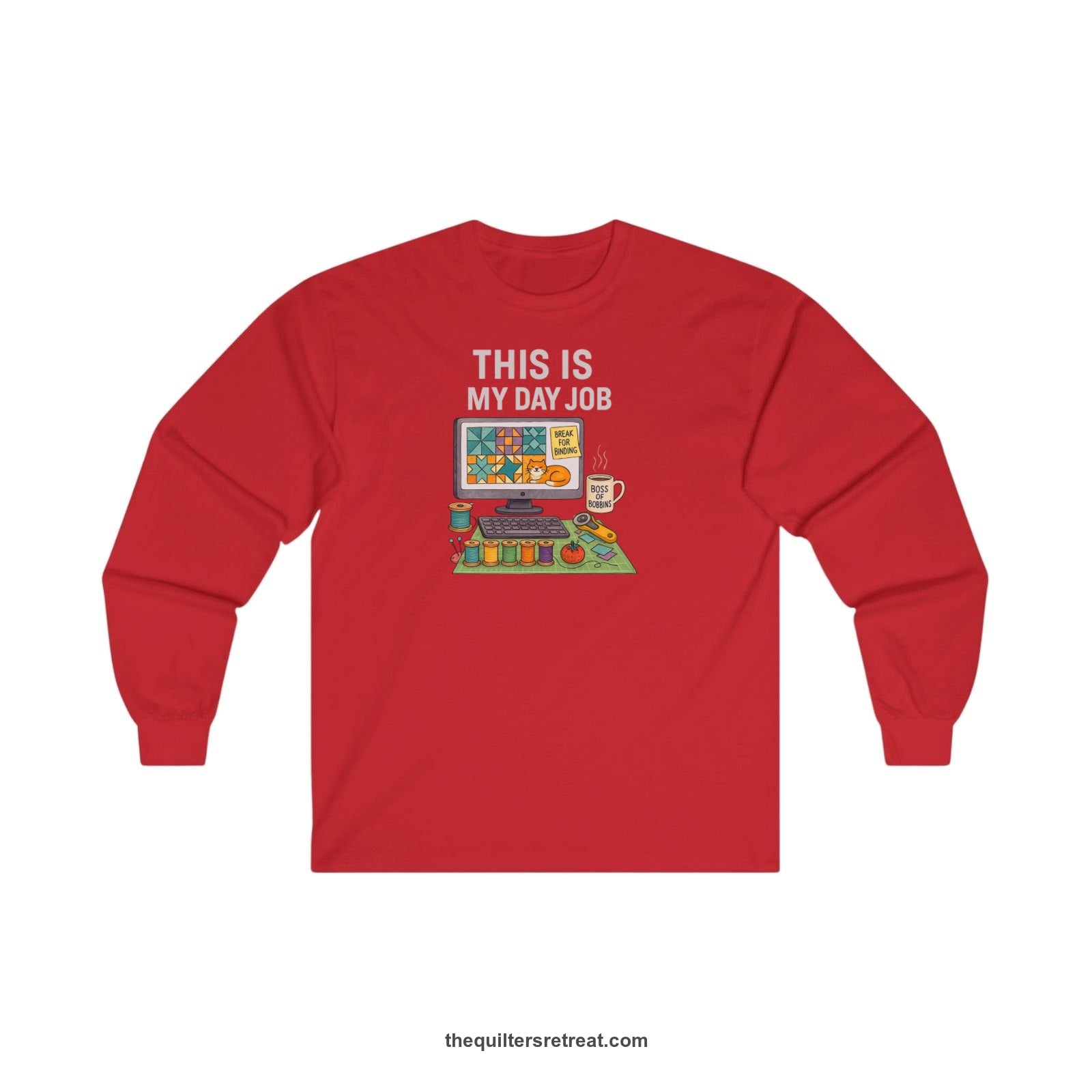 A Red Long Sleeve T-Shirt with a computer quilt design, cat illustration, "THIS IS MY DAY JOB" text with sewing tools, playful style
