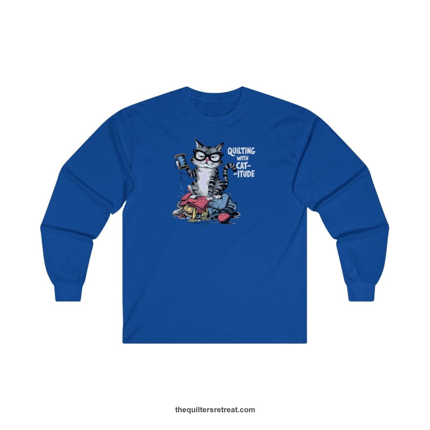 A Royal Long Sleeve T-Shirt with a grumpy cat holding thread spool atop fabric pile with "Quilting with Cat-itude" text