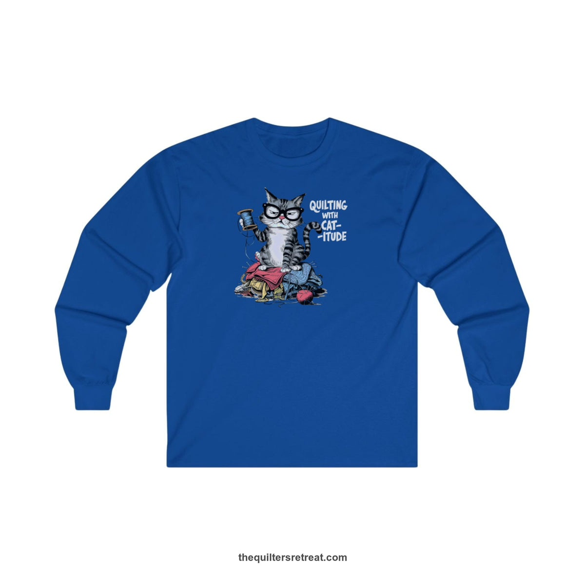 A Royal Long Sleeve T-Shirt with a grumpy cat holding thread spool atop fabric pile with "Quilting with Cat-itude" text