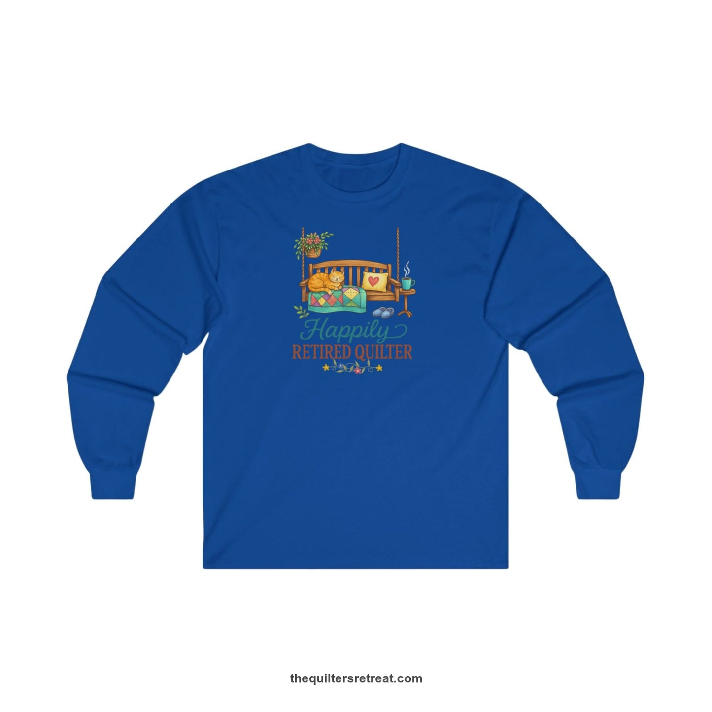 A Royal Long Sleeve T-Shirt with a hanging bench with cozy cat and quilt, surrounded by plants, "Happily Retired Quilter" text