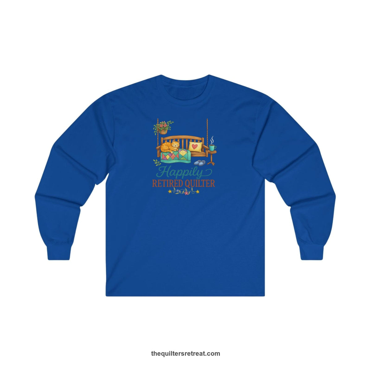 A Royal Long Sleeve T-Shirt with a hanging bench with cozy cat and quilt, surrounded by plants, "Happily Retired Quilter" text
