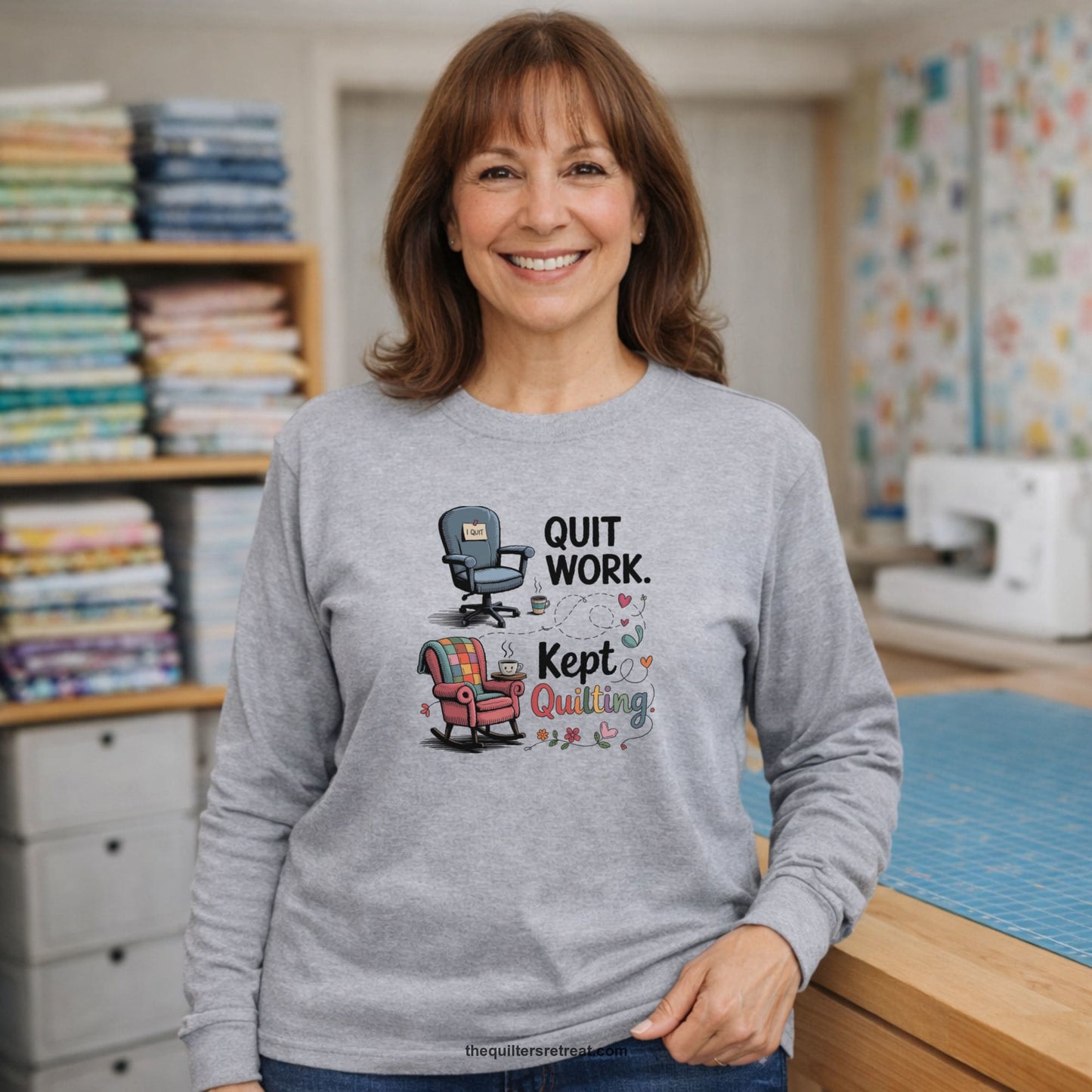 A Long Sleeve T-Shirt with a quit work kept quilting text with cozy chairs and colorful floral accents in a whimsical style