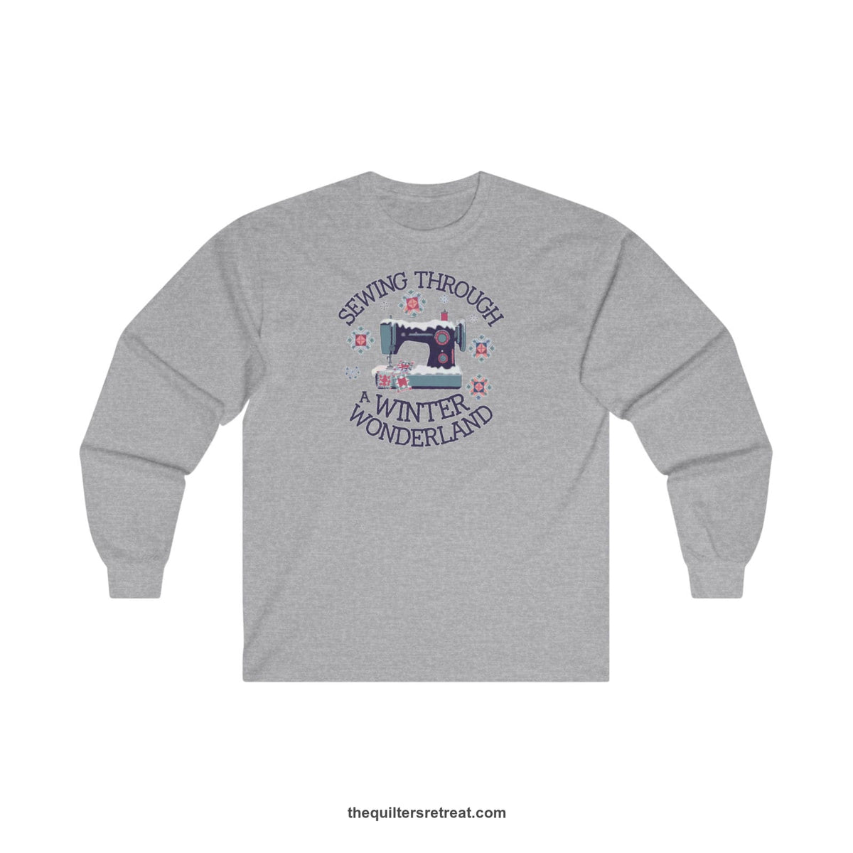 Quilter Gift: A Sport Grey Long Sleeve T-Shirt with sewing machine covered in snow with festive quilting elements and 'Sewing Through a Winter Wonderland' text
