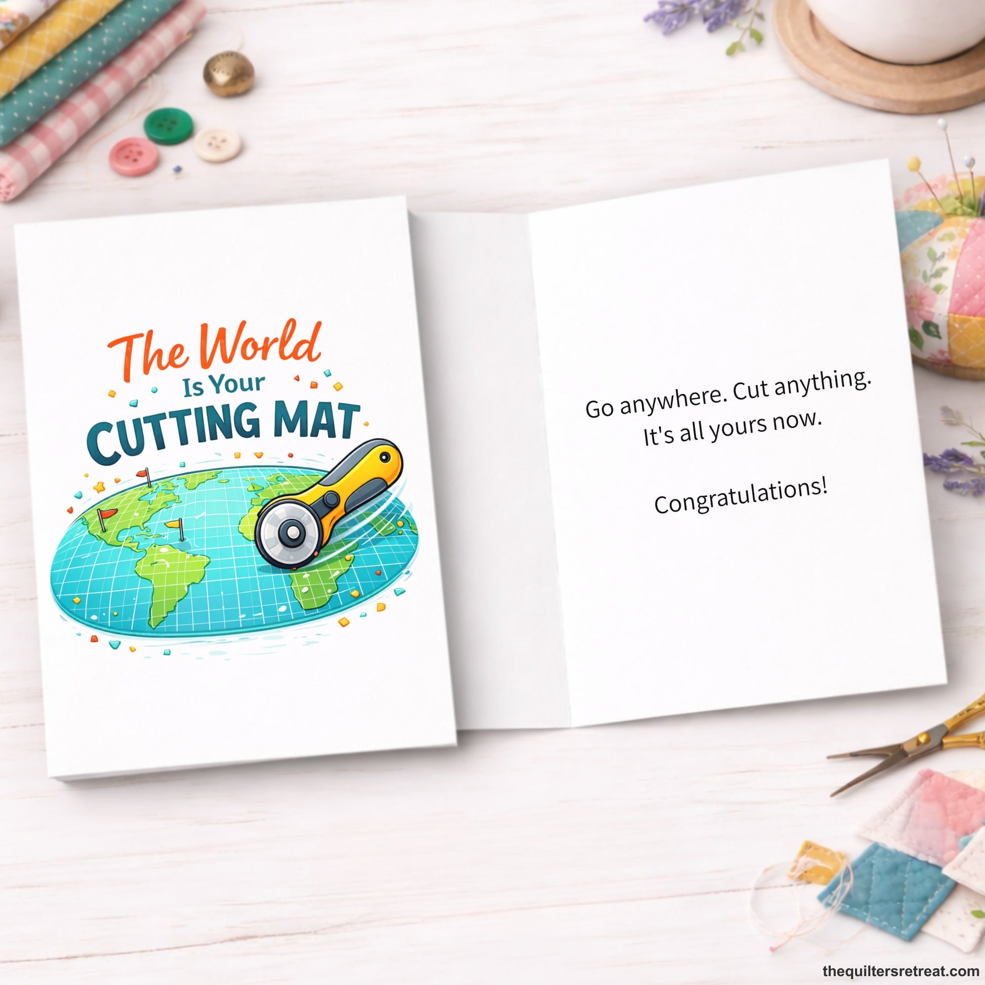 Quilter Gift: A  Greeting Card with Earth map with a rotary cutter, colorful elements, and text "The World Is Your Cutting Mat".