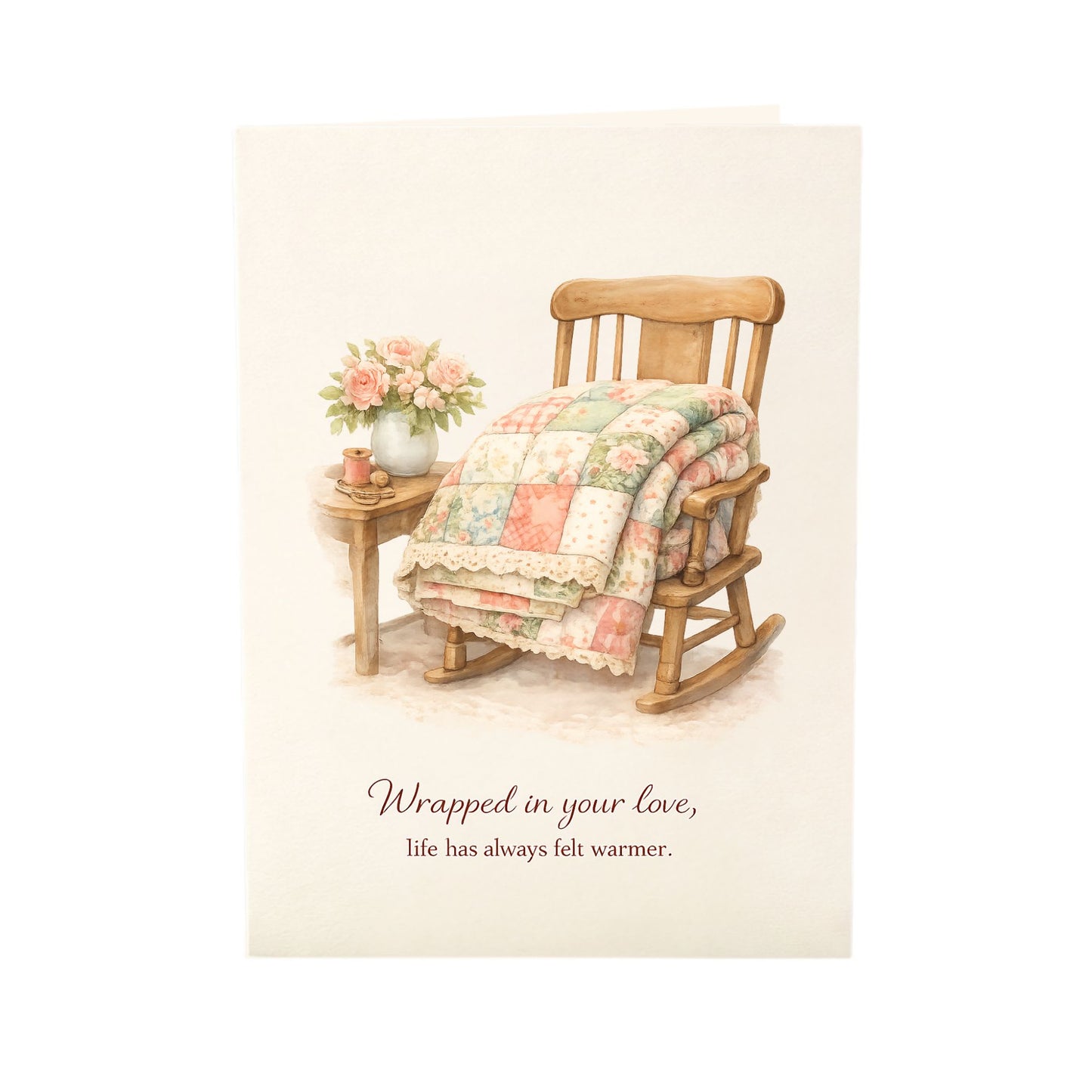 Quilter Gift: A Mother's Day Card - Soft with Wooden rocking chair with quilt and flowers, cozy vintage feel, "Wrapped in your love" text.