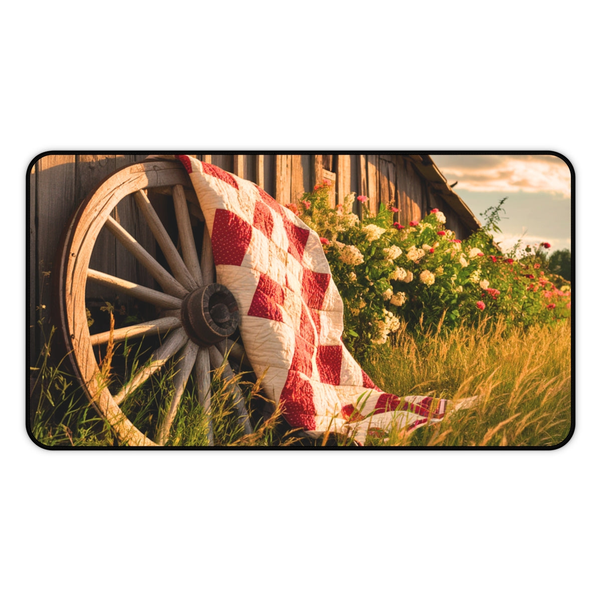 Red and white checkerboard quilt draped over an old wooden wagon wheel. Colorful flowers and golden grass surround the scene, with a rustic barn in the background. Perfect gift for quilters.