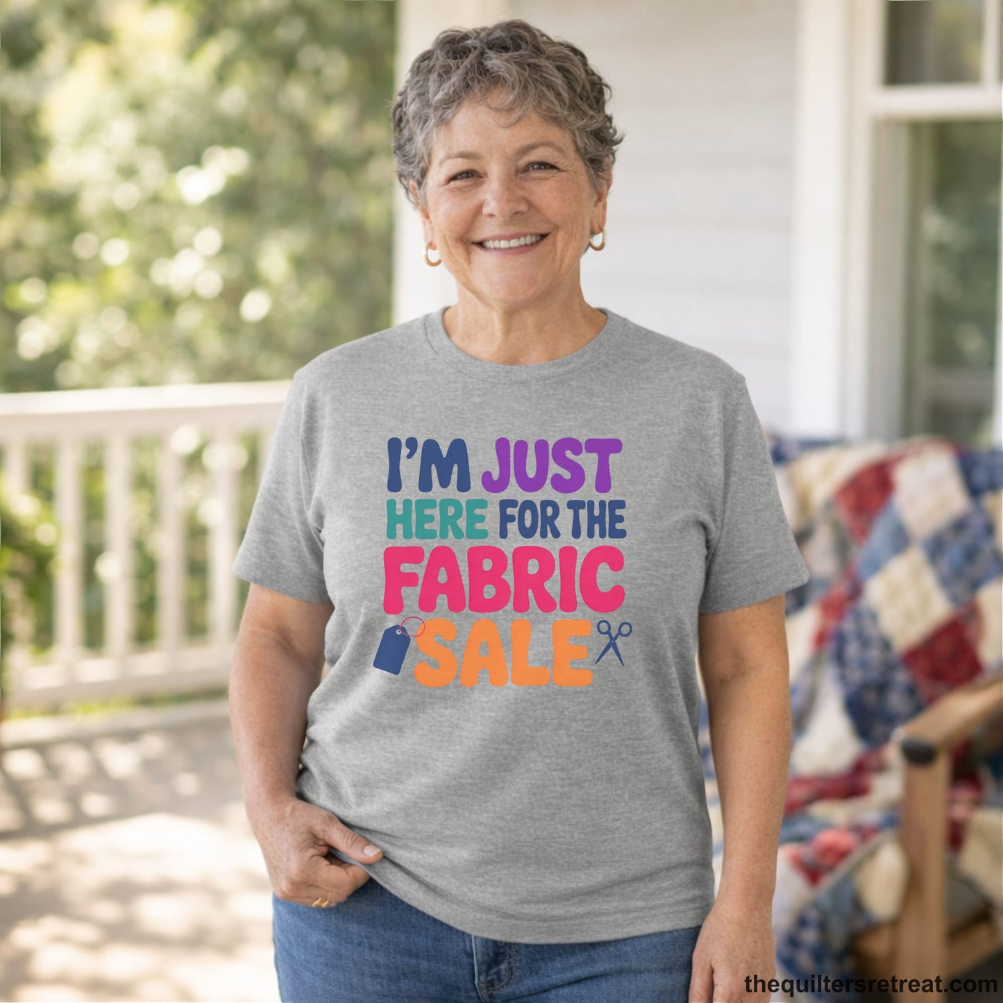 A Short Sleeve T-Shirt with a playful "I'm Just Here for the Fabric Sale" text with colorful letters and sewing icons