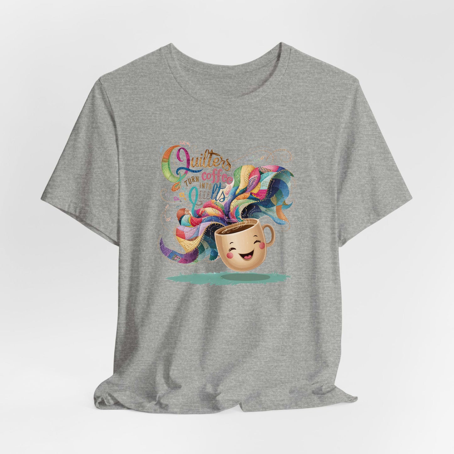A Athletic Heather Short Sleeve T-Shirt with a quirky "Quilters Turn Coffee into Quilts" text with vibrant swirling patterns
