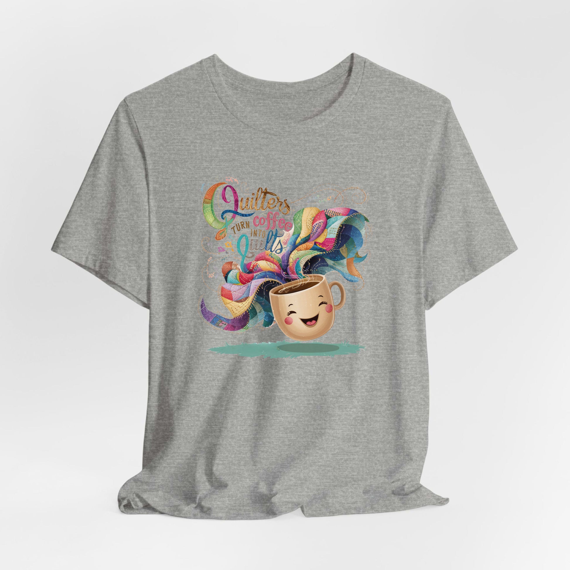A Athletic Heather Short Sleeve T-Shirt with a quirky "Quilters Turn Coffee into Quilts" text with vibrant swirling patterns