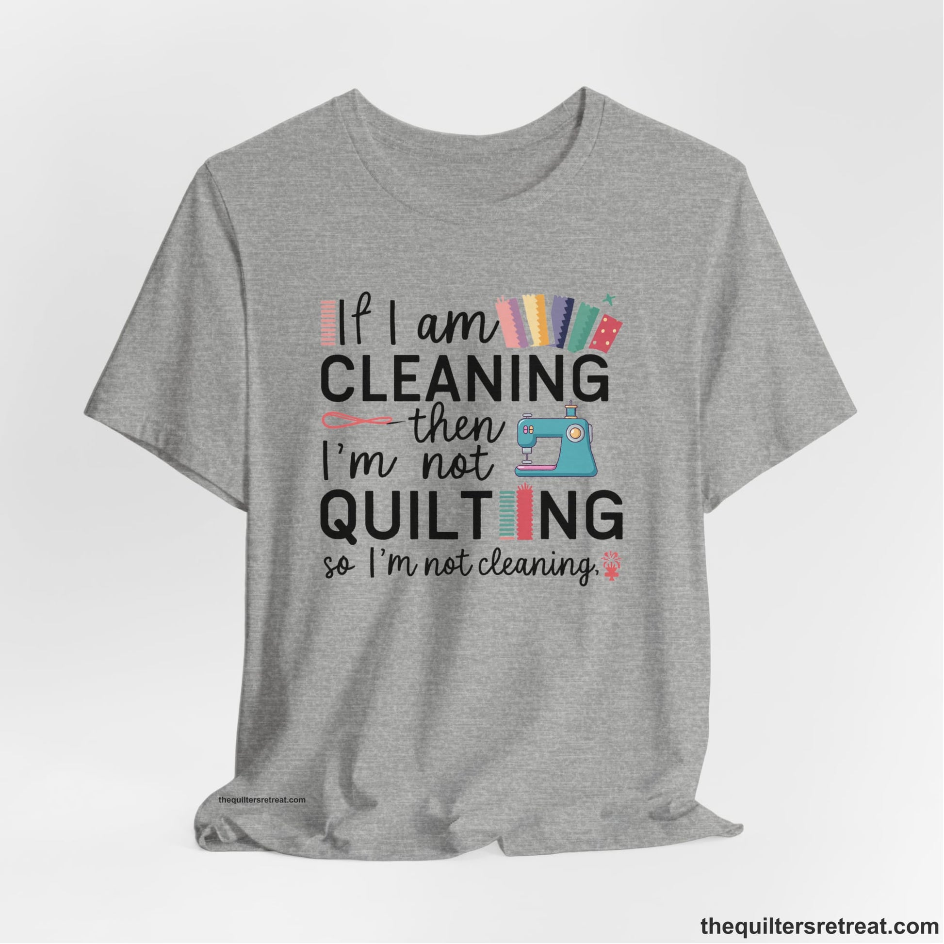 A Athletic Heather Short Sleeve T-Shirt with a If I am cleaning then I'm not quilting text with sewing machine and fabric graphics