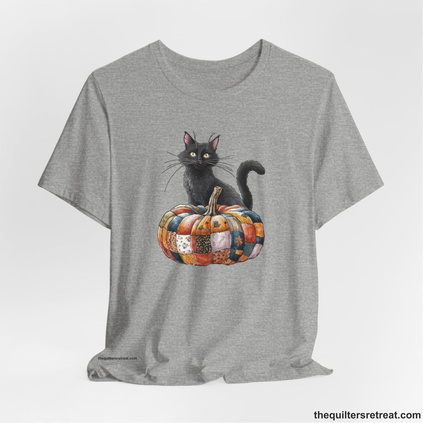 A Athletic Heather Short Sleeve T-Shirt with a black cat with a quilted patchwork pumpkin in a whimsical autumn style