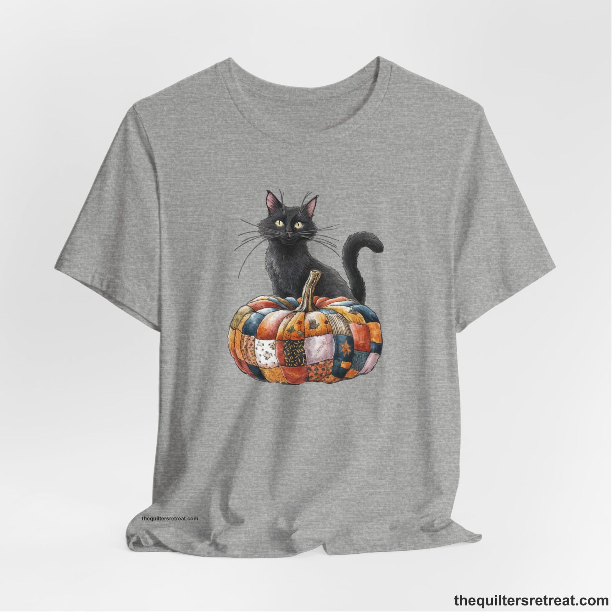 A Athletic Heather Short Sleeve T-Shirt with a black cat with a quilted patchwork pumpkin in a whimsical autumn style