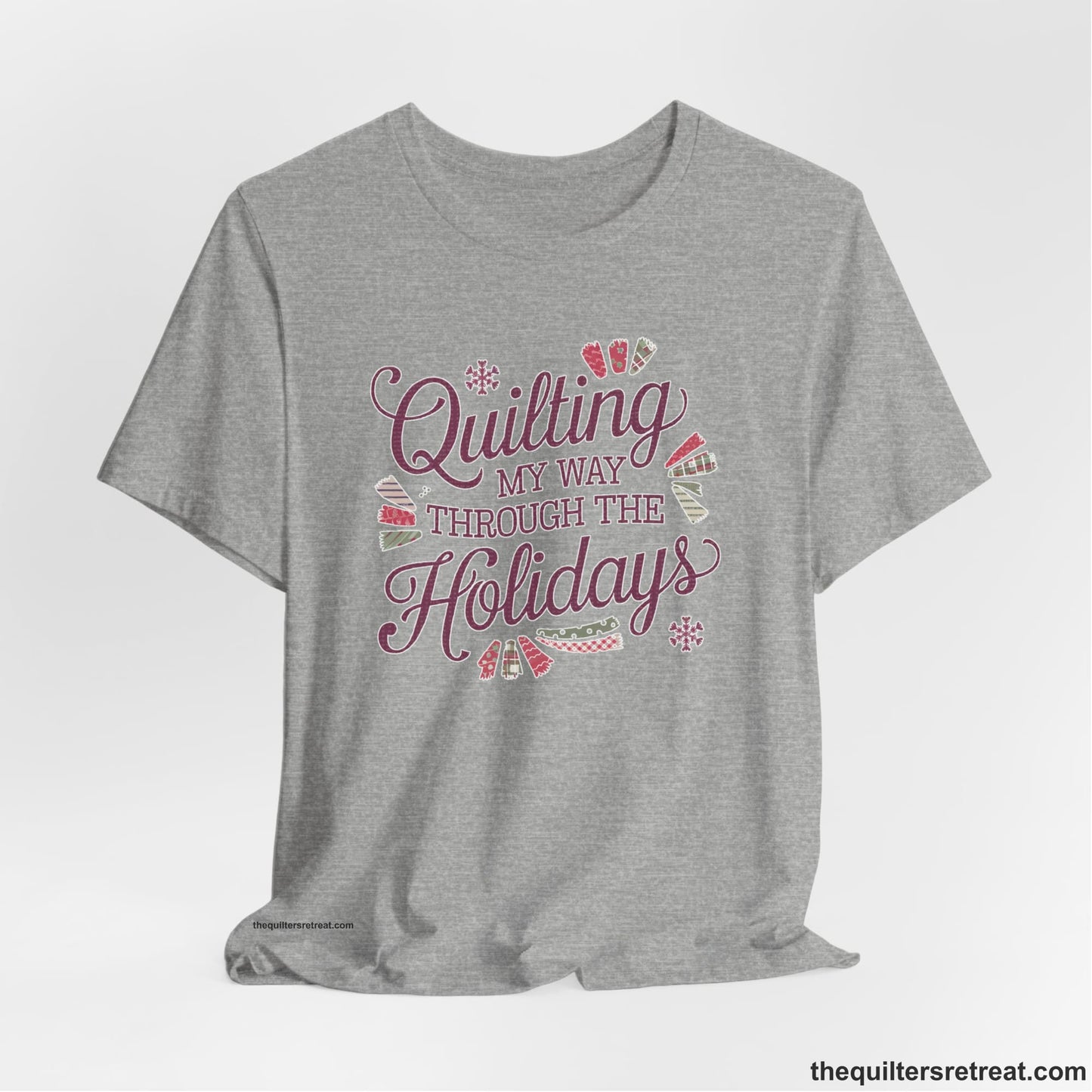 A Athletic Heather Short Sleeve T-Shirt with a quilting-themed text in festive colors with decorative quilt patterns