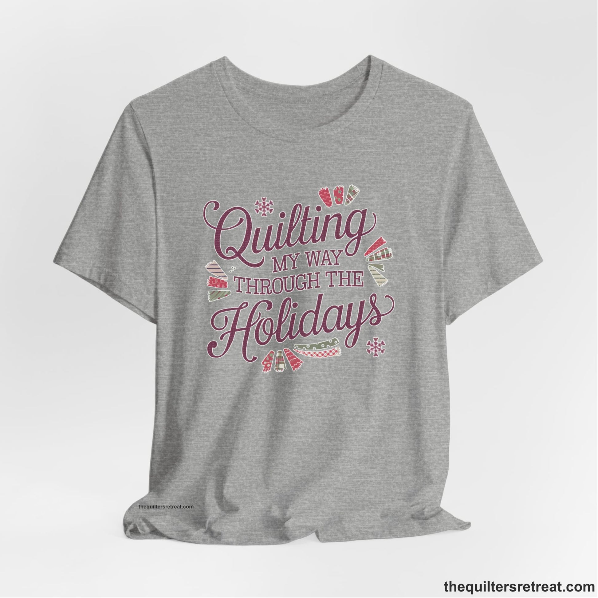 A Athletic Heather Short Sleeve T-Shirt with a quilting-themed text in festive colors with decorative quilt patterns
