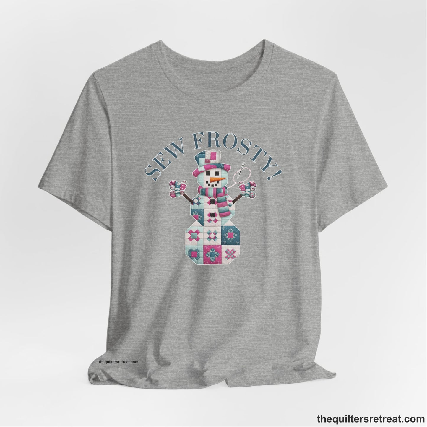 A Athletic Heather Short Sleeve T-Shirt with a snowman quilt pattern with "Sew Frosty!" text in a crafty style