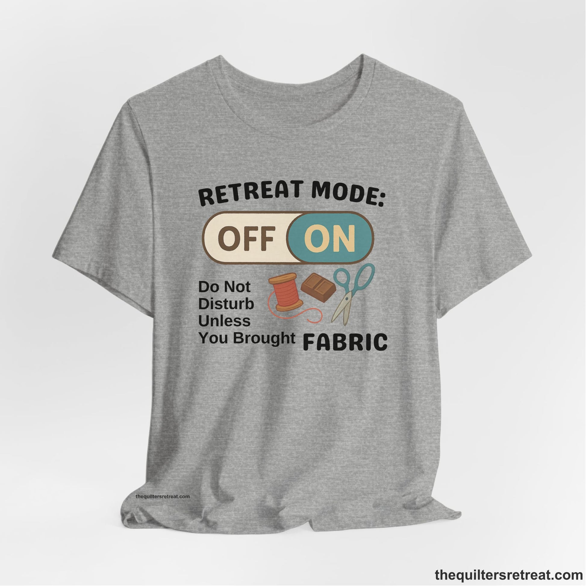 A Athletic Heather Short Sleeve T-Shirt with a illustration of sewing tools with a playful "OFF ON" switch design