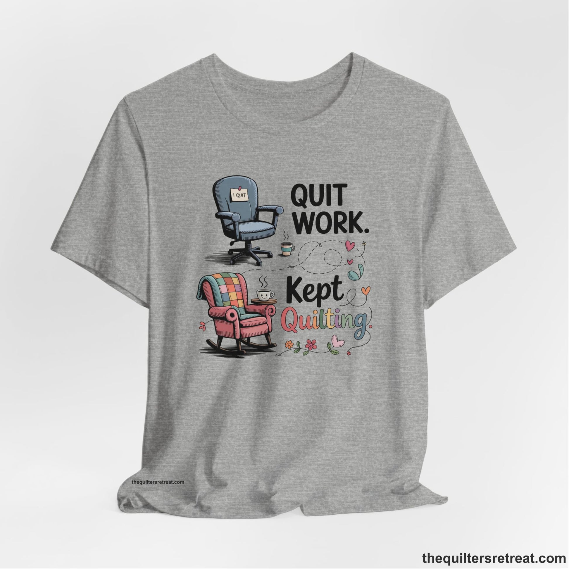 A Athletic Heather Short Sleeve T-Shirt with a quit work kept quilting text with cozy chairs and colorful floral accents in a whimsical style