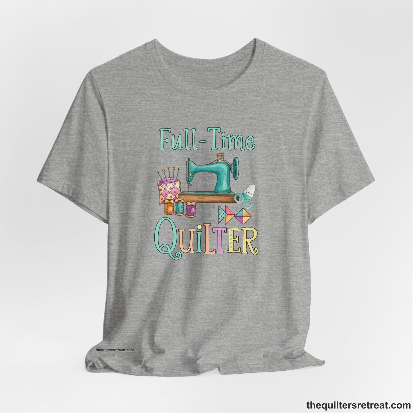 A Athletic Heather Short Sleeve T-Shirt with a vintage sewing machine with colorful threads and "Full-Time Quilter" text in playful style