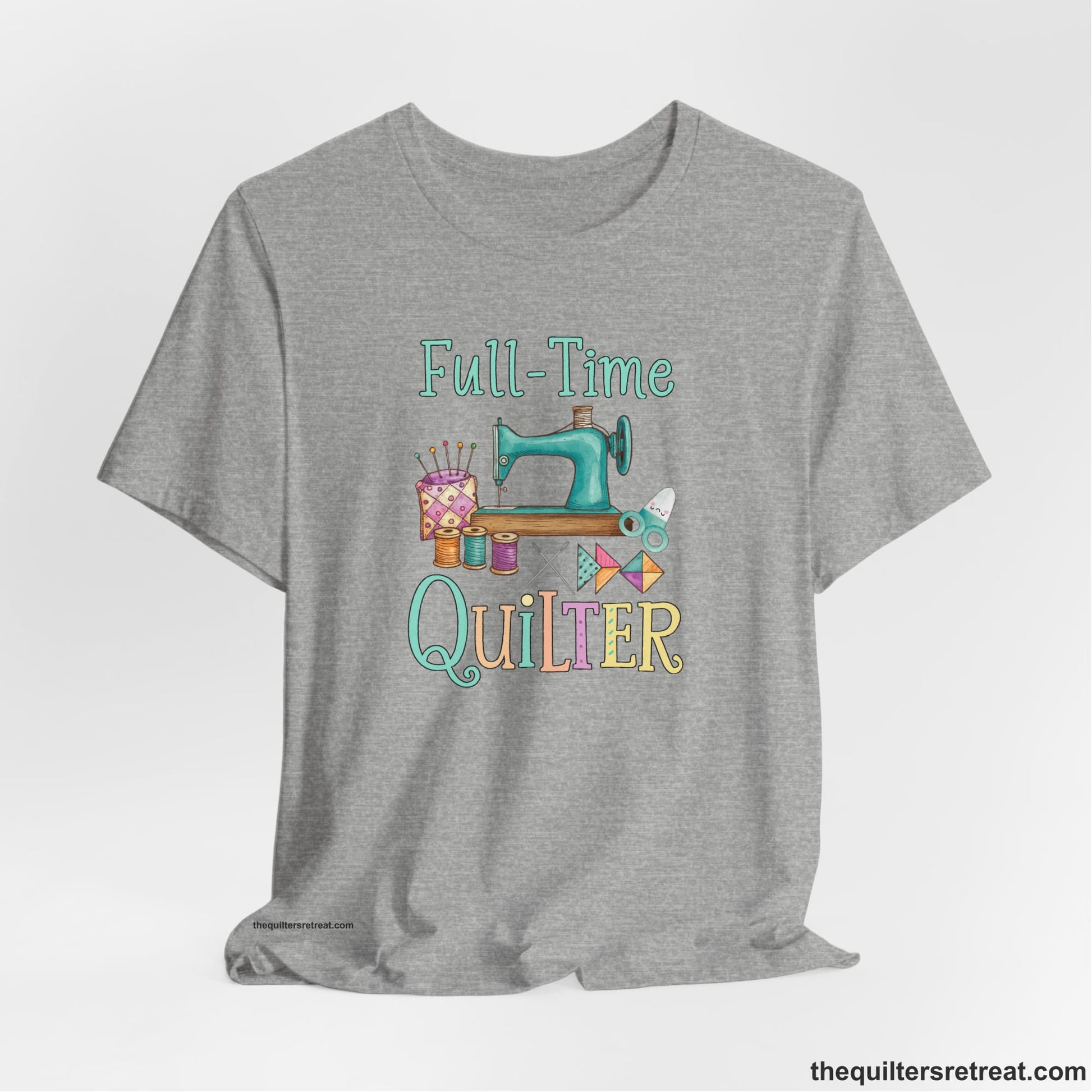 A Athletic Heather Short Sleeve T-Shirt with a vintage sewing machine with colorful threads and "Full-Time Quilter" text in playful style