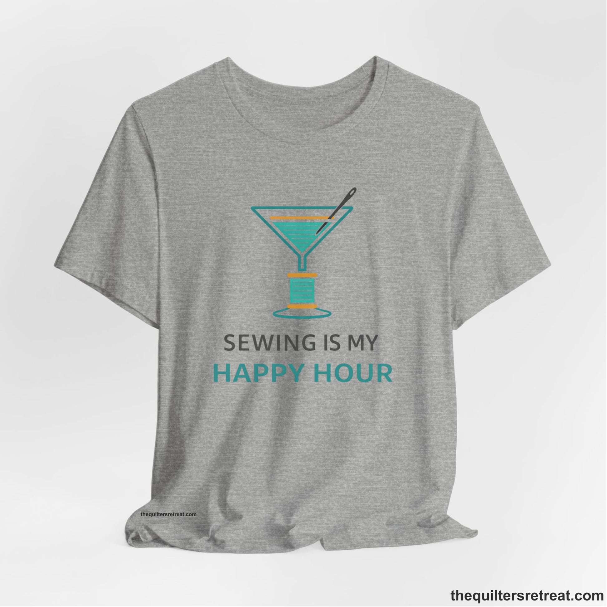 A Athletic Heather Short Sleeve T-Shirt with a Martini glass with spool of thread, needle; text: "Sewing is My Happy Hour."