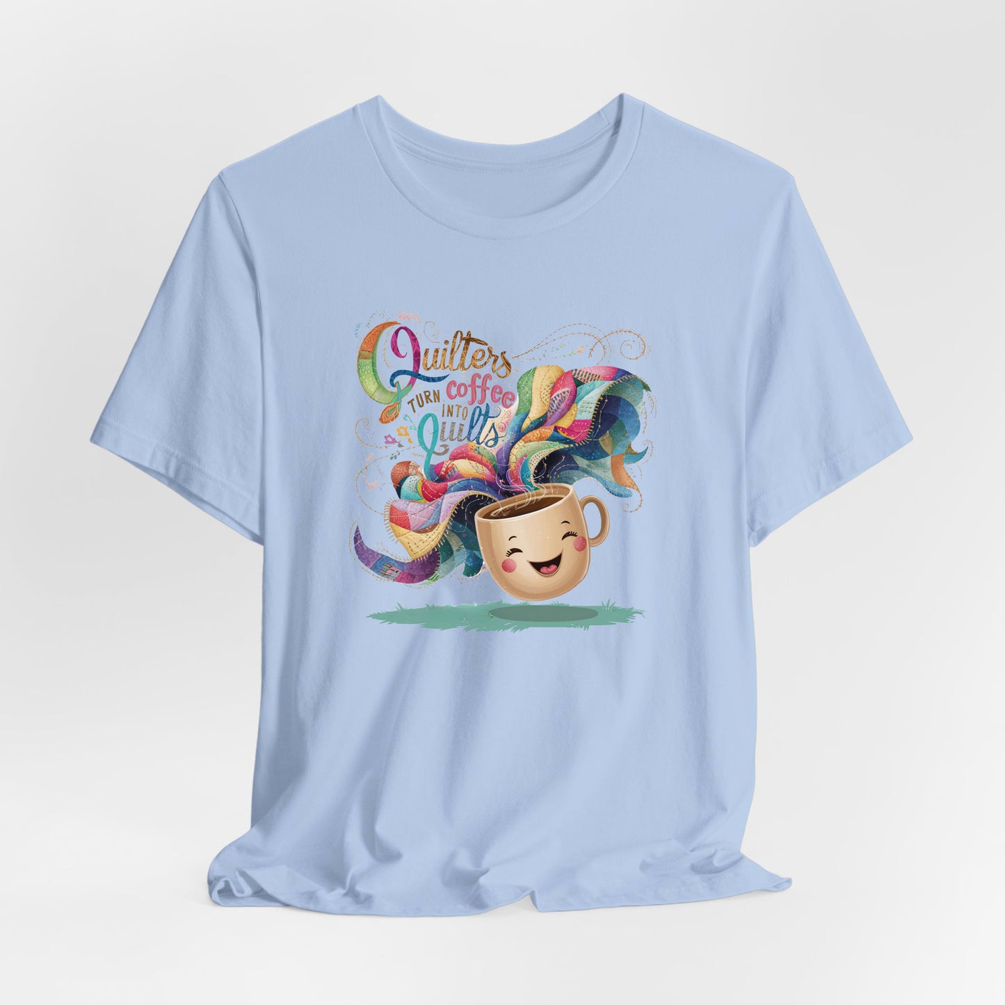 A Baby Blue Short Sleeve T-Shirt with a quirky "Quilters Turn Coffee into Quilts" text with vibrant swirling patterns
