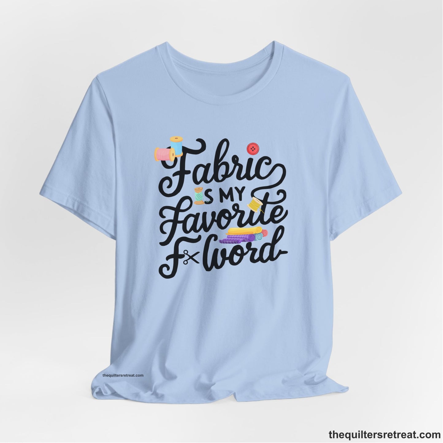 A Baby Blue Short Sleeve T-Shirt with a fabric is my favorite f word text with colorful spools and buttons in a playful style