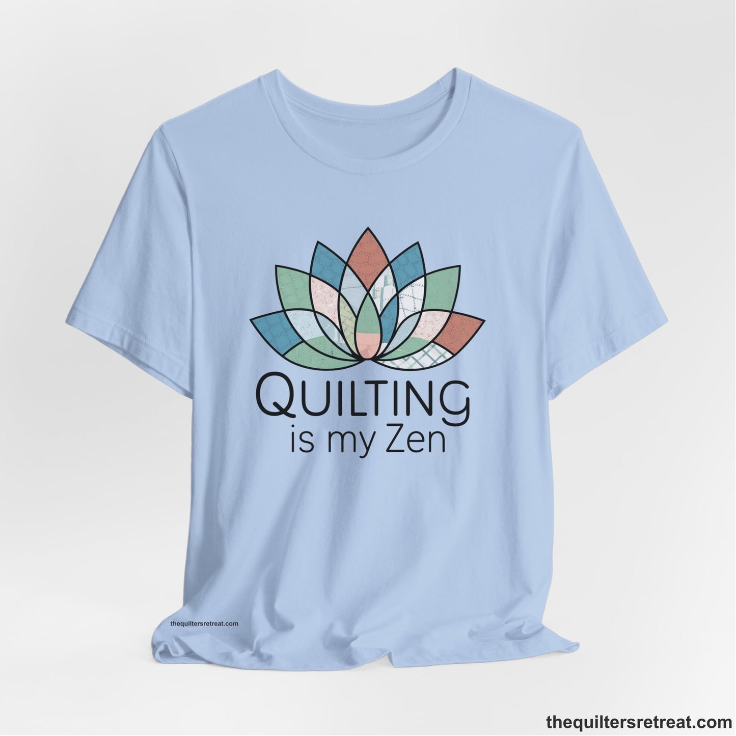 A Baby Blue Short Sleeve T-Shirt with a floral quilt pattern with "Quilting is my Zen" text in a calm, soothing design