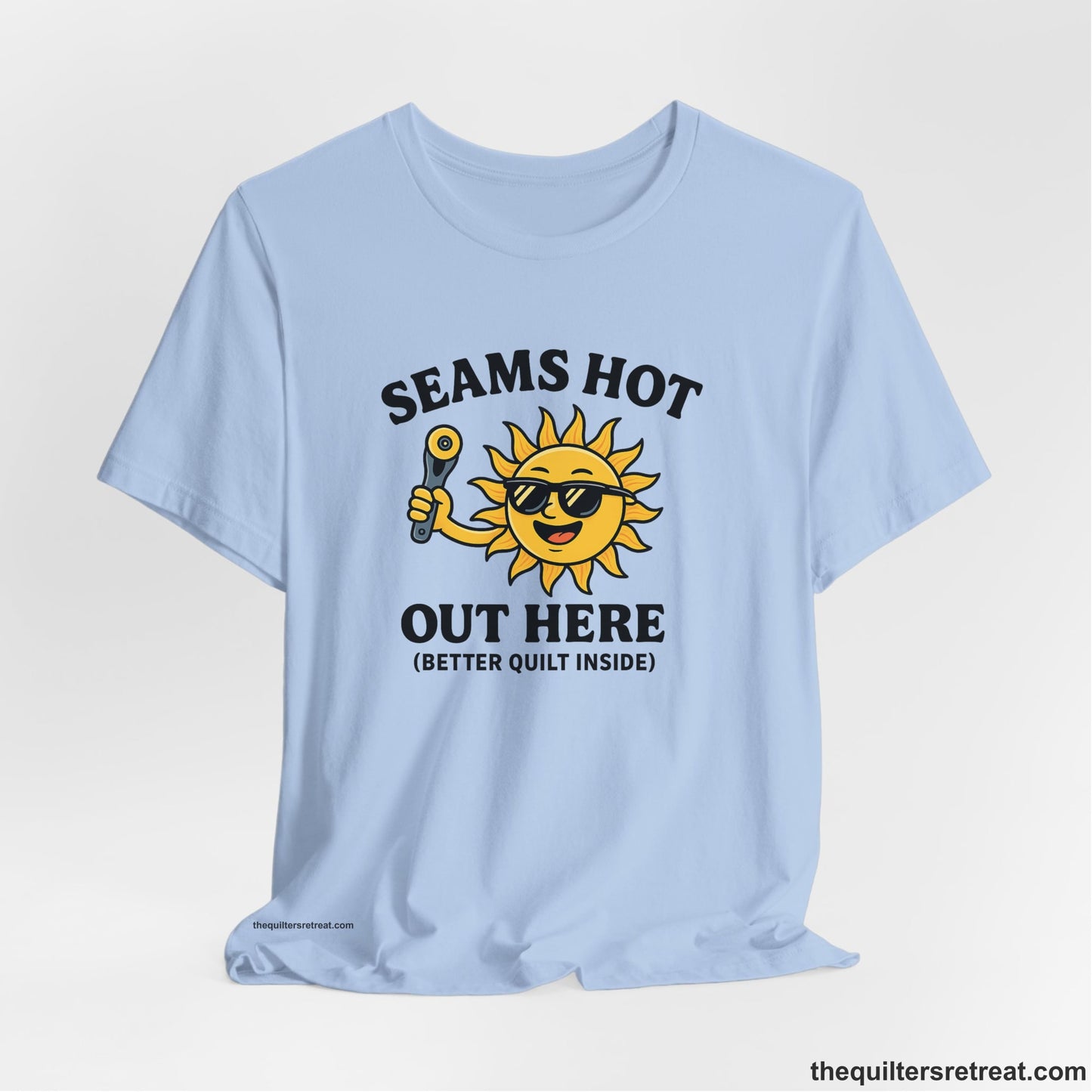 A Baby Blue Short Sleeve T-Shirt with a smiling sun with sunglasses holding a pizza cutter in a playful cartoon style