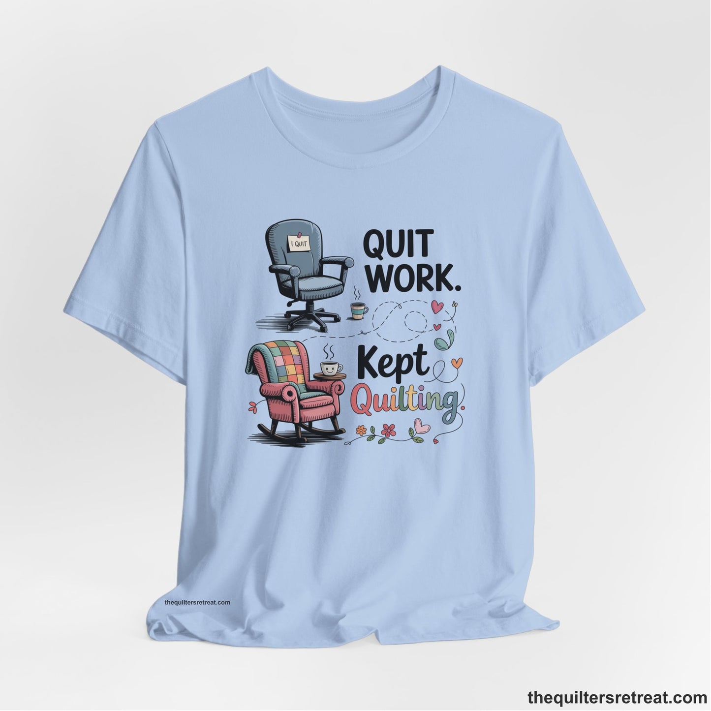 A Baby Blue Short Sleeve T-Shirt with a quit work kept quilting text with cozy chairs and colorful floral accents in a whimsical style