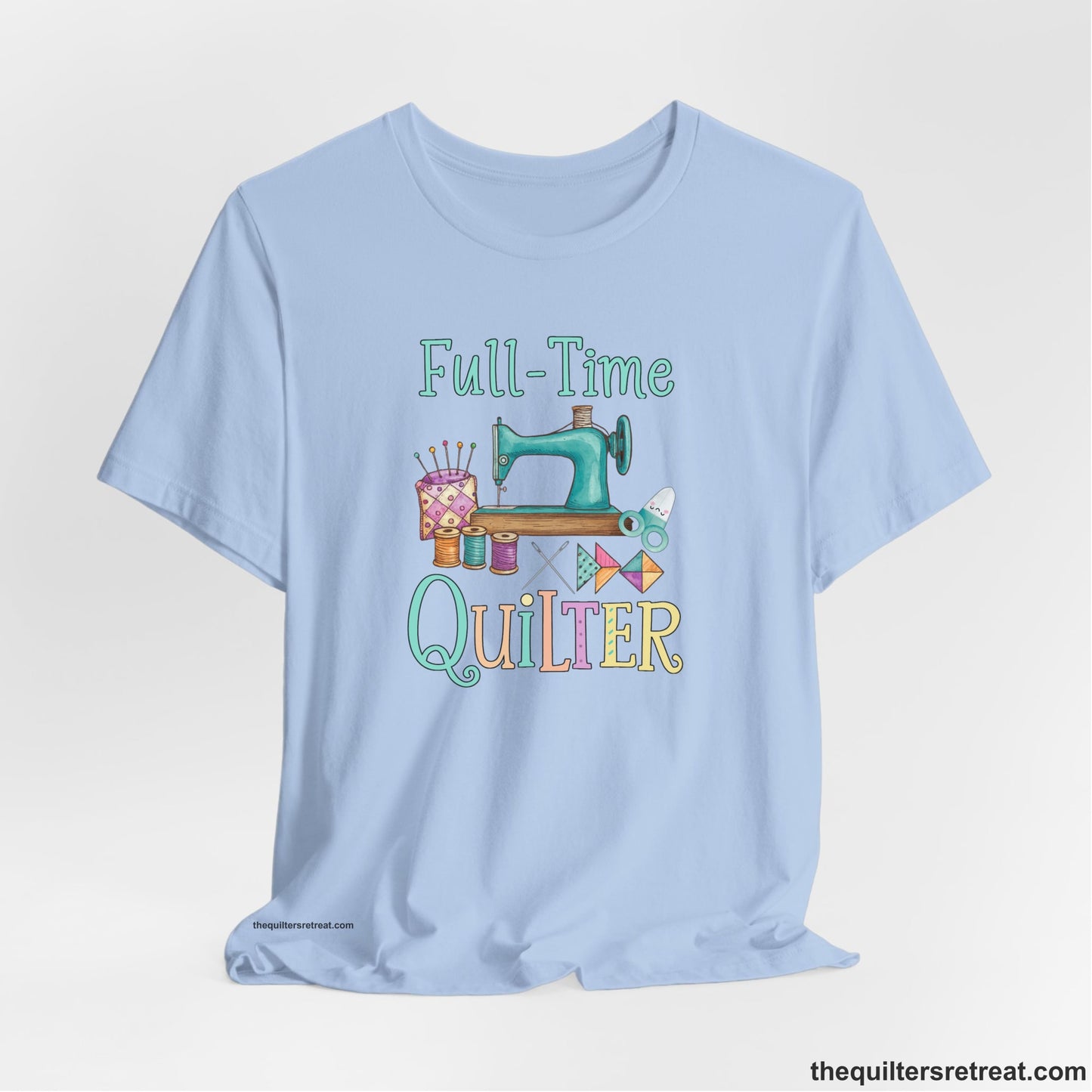 A Baby Blue Short Sleeve T-Shirt with a vintage sewing machine with colorful threads and "Full-Time Quilter" text in playful style