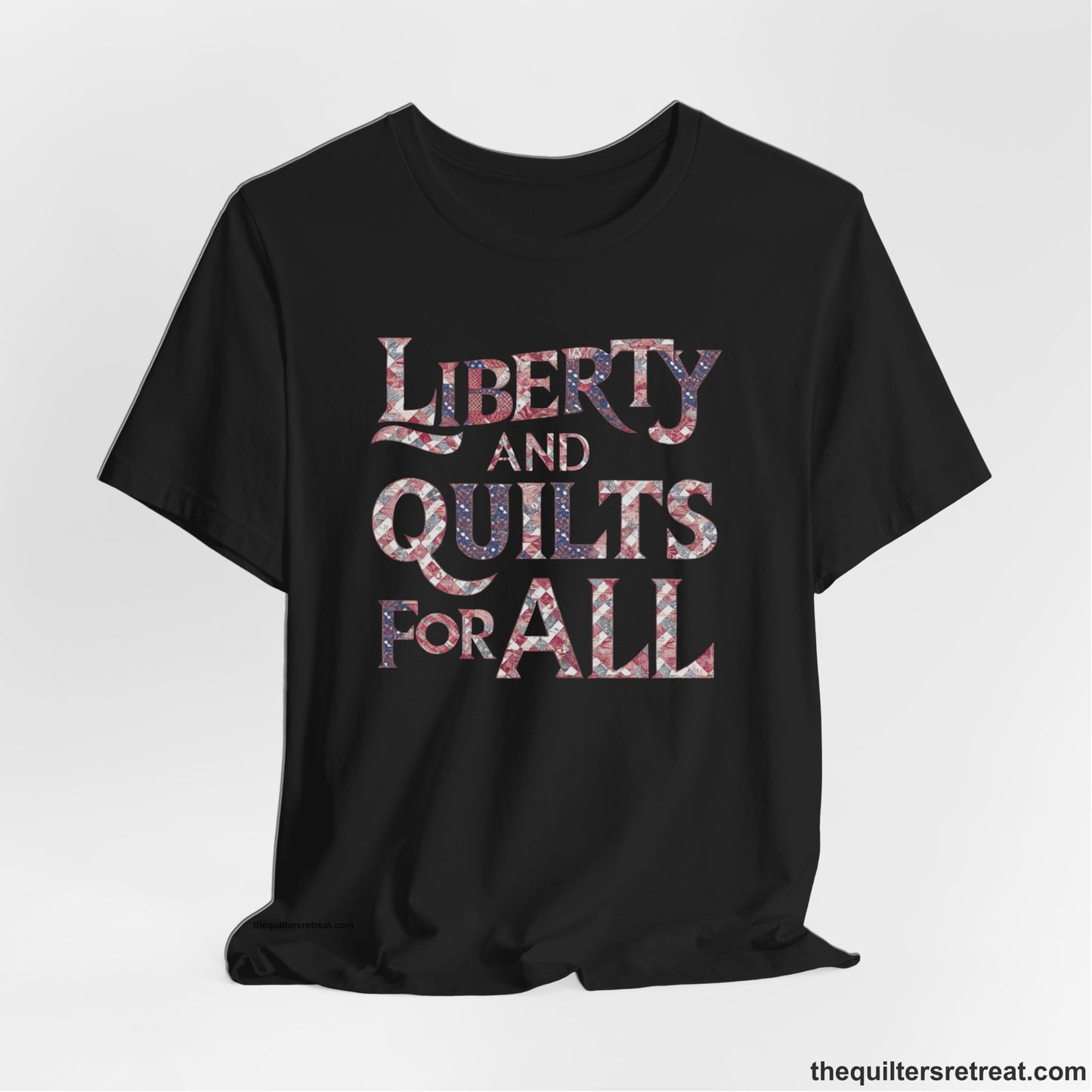 A Black Short Sleeve T-Shirt with a Liberty and Quilts for All" text with patchwork quilt pattern in a vintage style