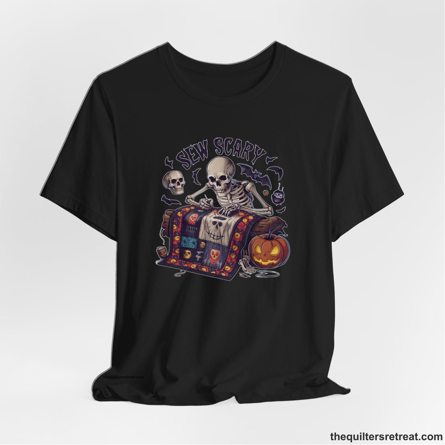 A Black Short Sleeve T-Shirt with a skeleton quilting with spooky accents and "Sew Scary" text in a Halloween theme