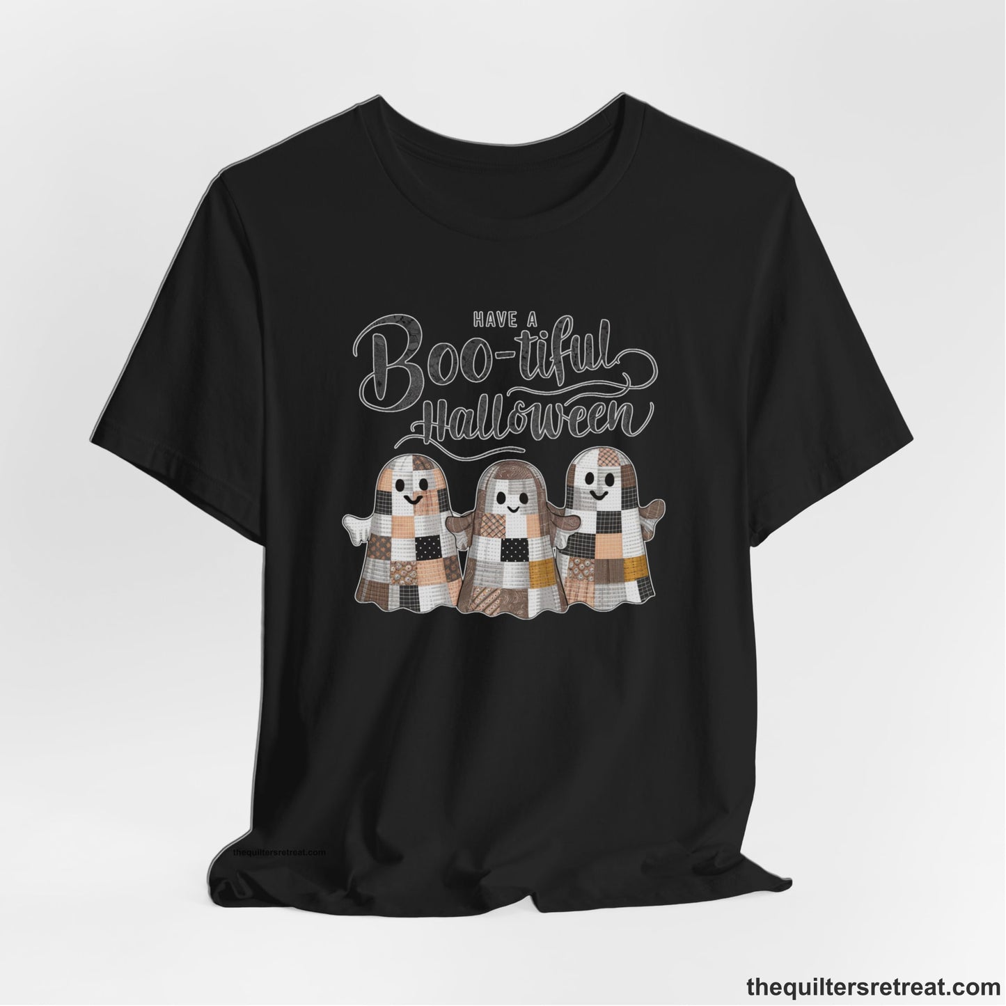 A Black Short Sleeve T-Shirt with a cute patchwork ghosts with "Boo-tiful Halloween" text in a playful style