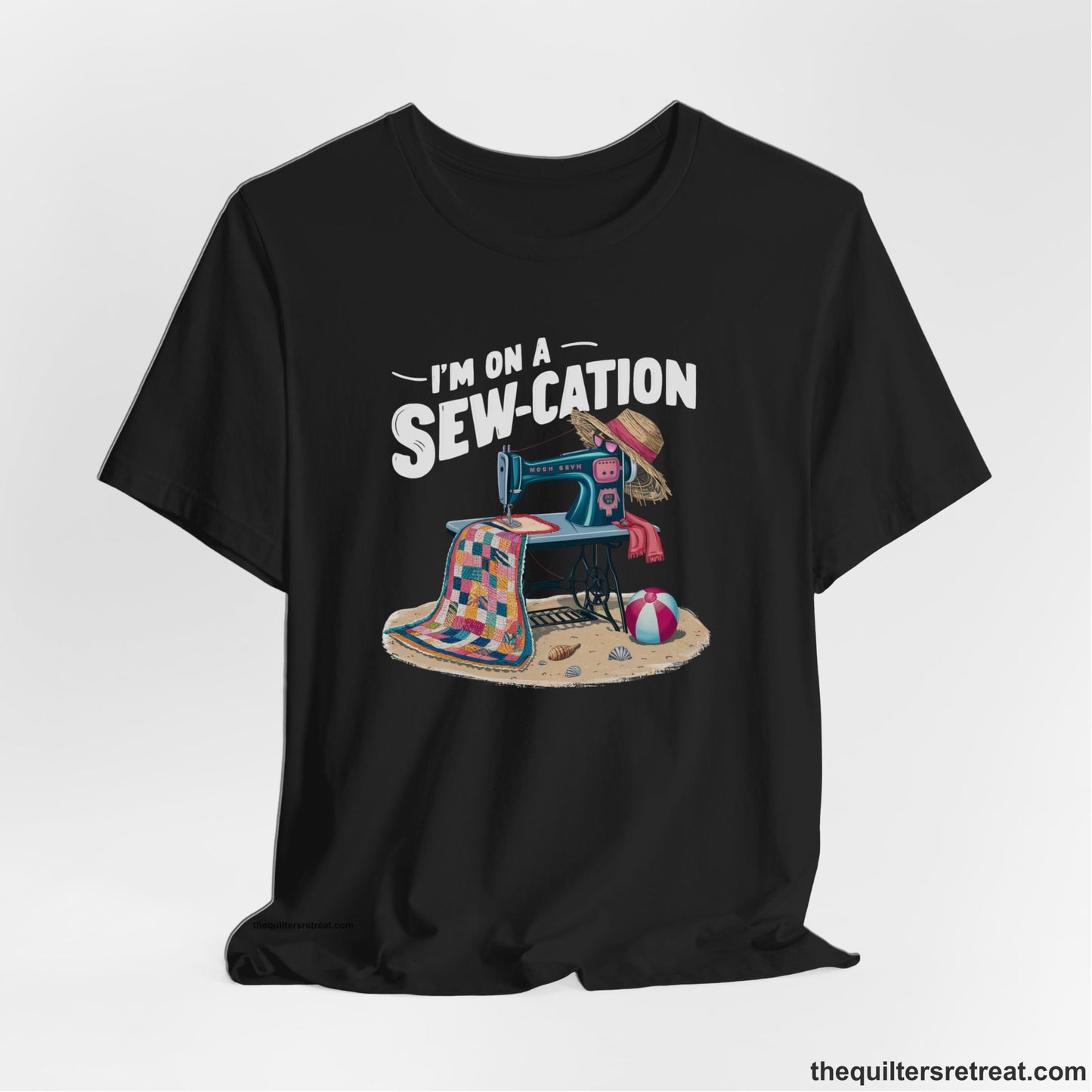 A Black Short Sleeve T-Shirt with a vintage sewing machine with colorful quilt, beach items, and "I'm On A Sew-Cation" text