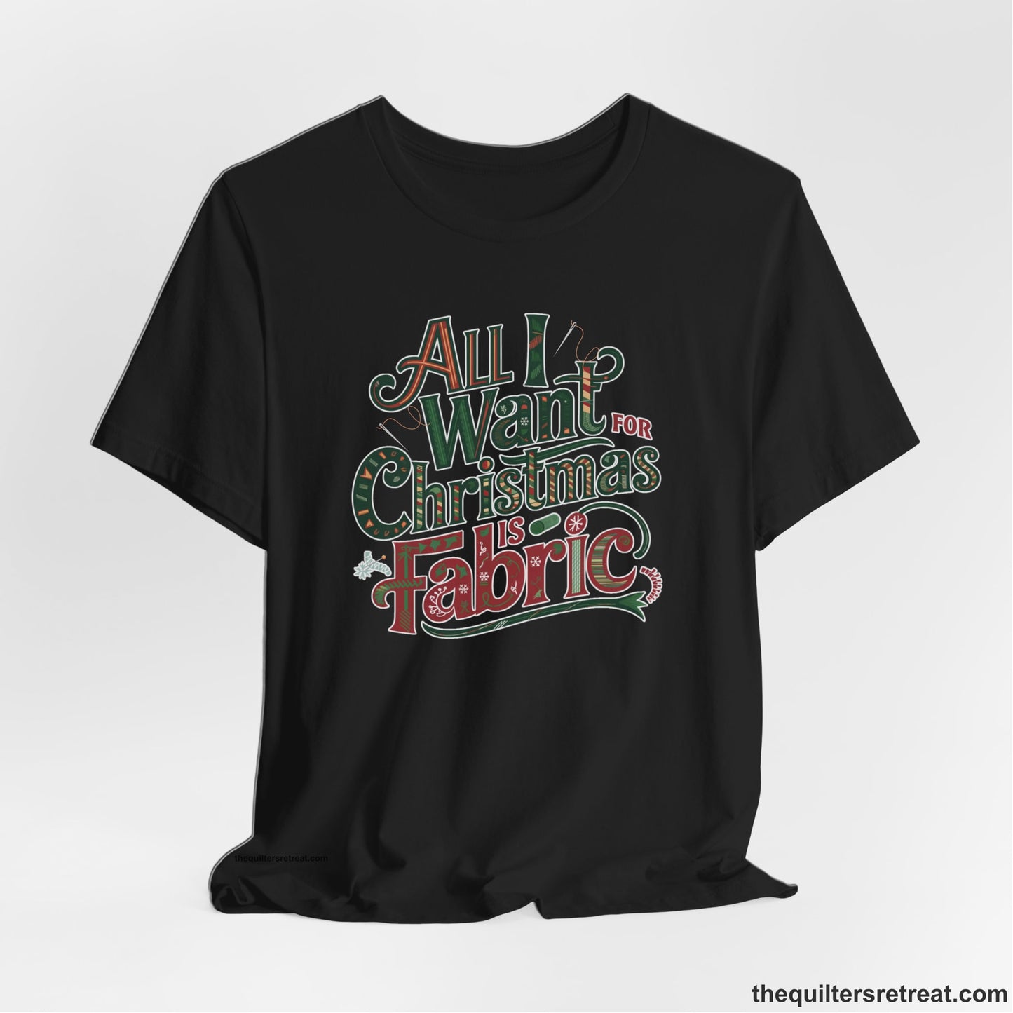 A Black Short Sleeve T-Shirt with a vintage holiday text "All I Want for Christmas is Fabric" with festive motifs