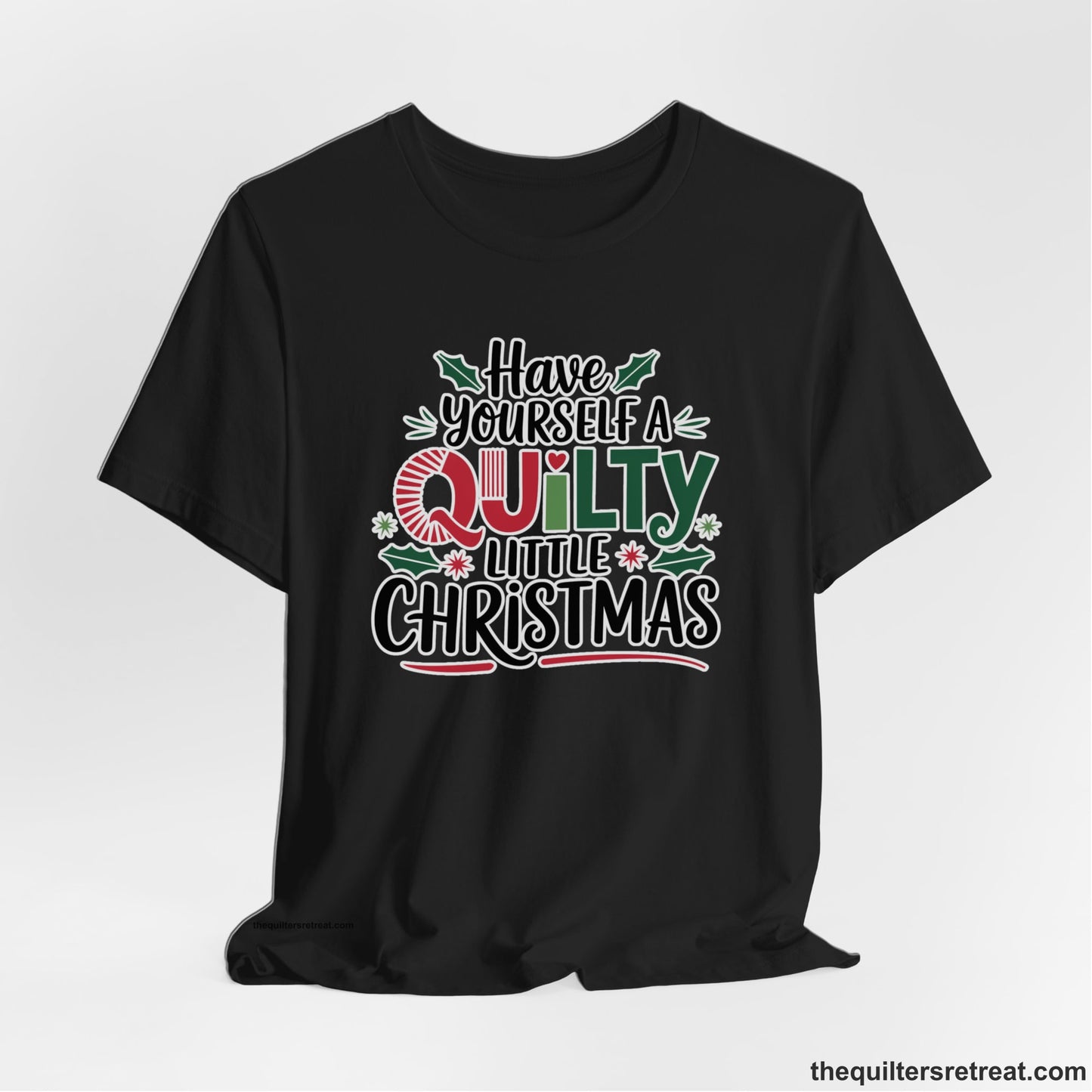 A Black Short Sleeve T-Shirt with a festive "Have Yourself a Quilty Little Christmas" text with holly and quilt patterns