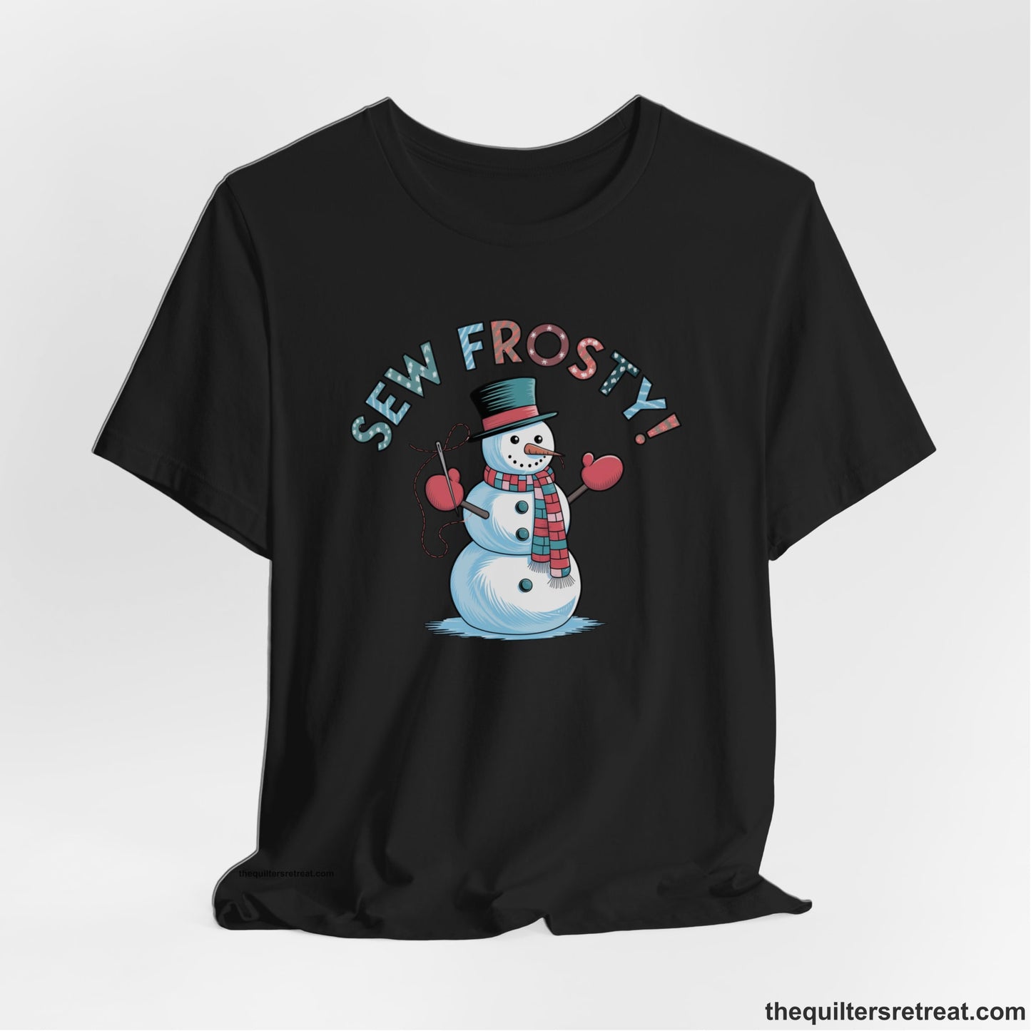 A Black Short Sleeve T-Shirt with a playful snowman sewing illustration with "Sew Frosty!" text in a festive style