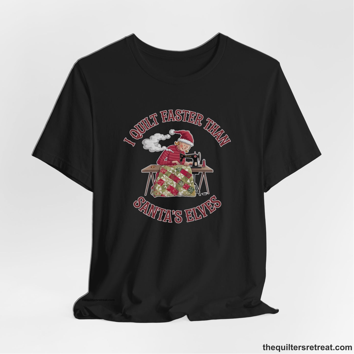 A Black Short Sleeve T-Shirt with a whimsical illustration of a quilting woman with "I Quilt Faster Than Santa's Elves" text