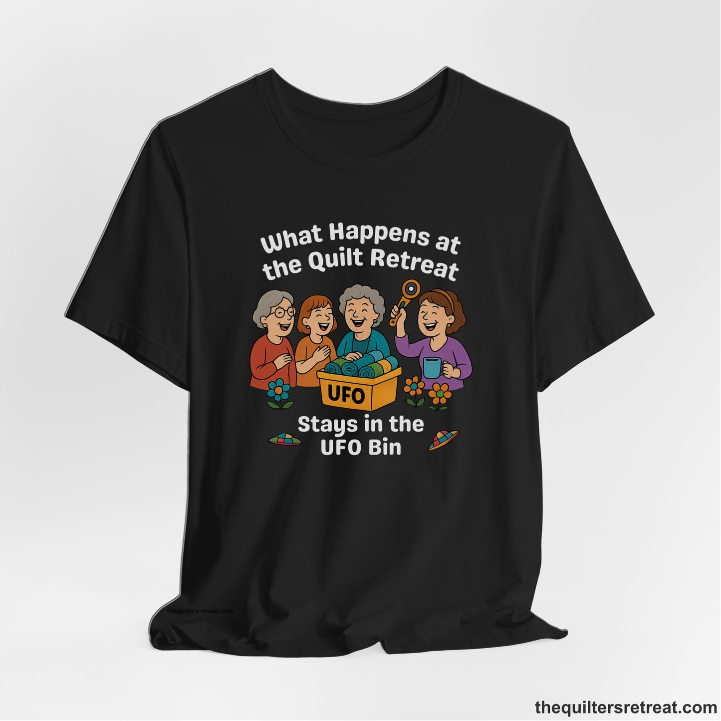 A Black Short Sleeve T-Shirt with a four smiling women with unfinished fabric objects and playful "UFO" text in a cartoon style