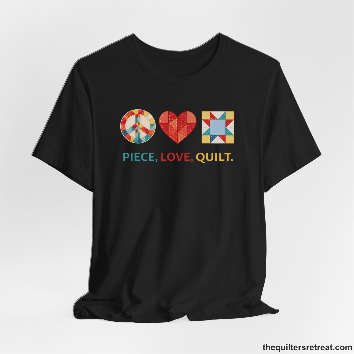 A Black Short Sleeve T-Shirt with a Colorful quilt patterns, "PIECE, LOVE, QUILT." text, whimsical style.