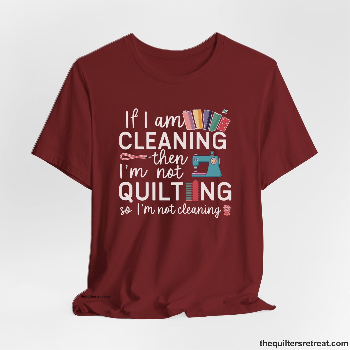 A Cardinal Short Sleeve T-Shirt with a If I am cleaning then I'm not quilting text with sewing machine and fabric graphics