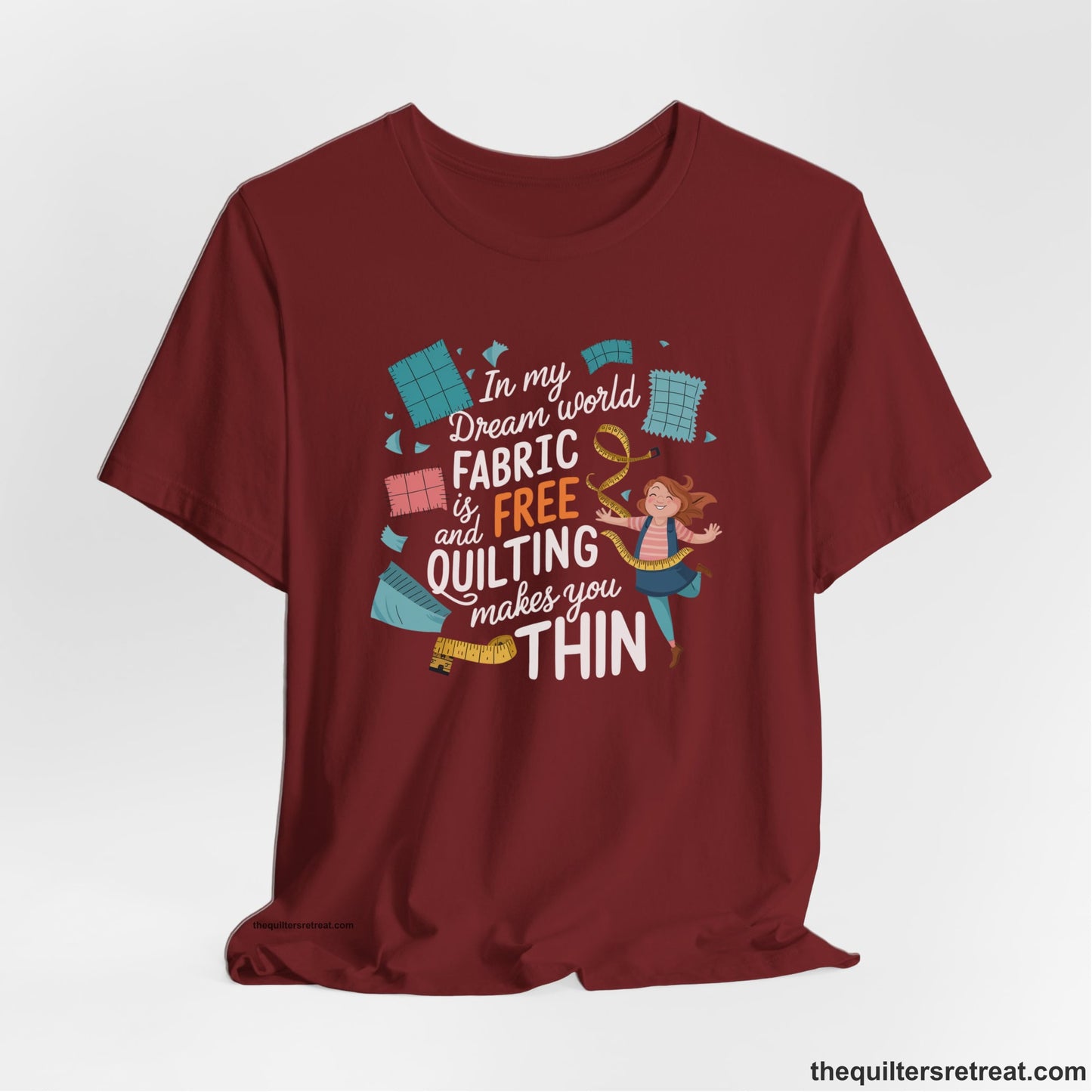 A Cardinal Short Sleeve T-Shirt with a inspirational quilting text with playful seamstress and colorful fabric scraps in whimsical style