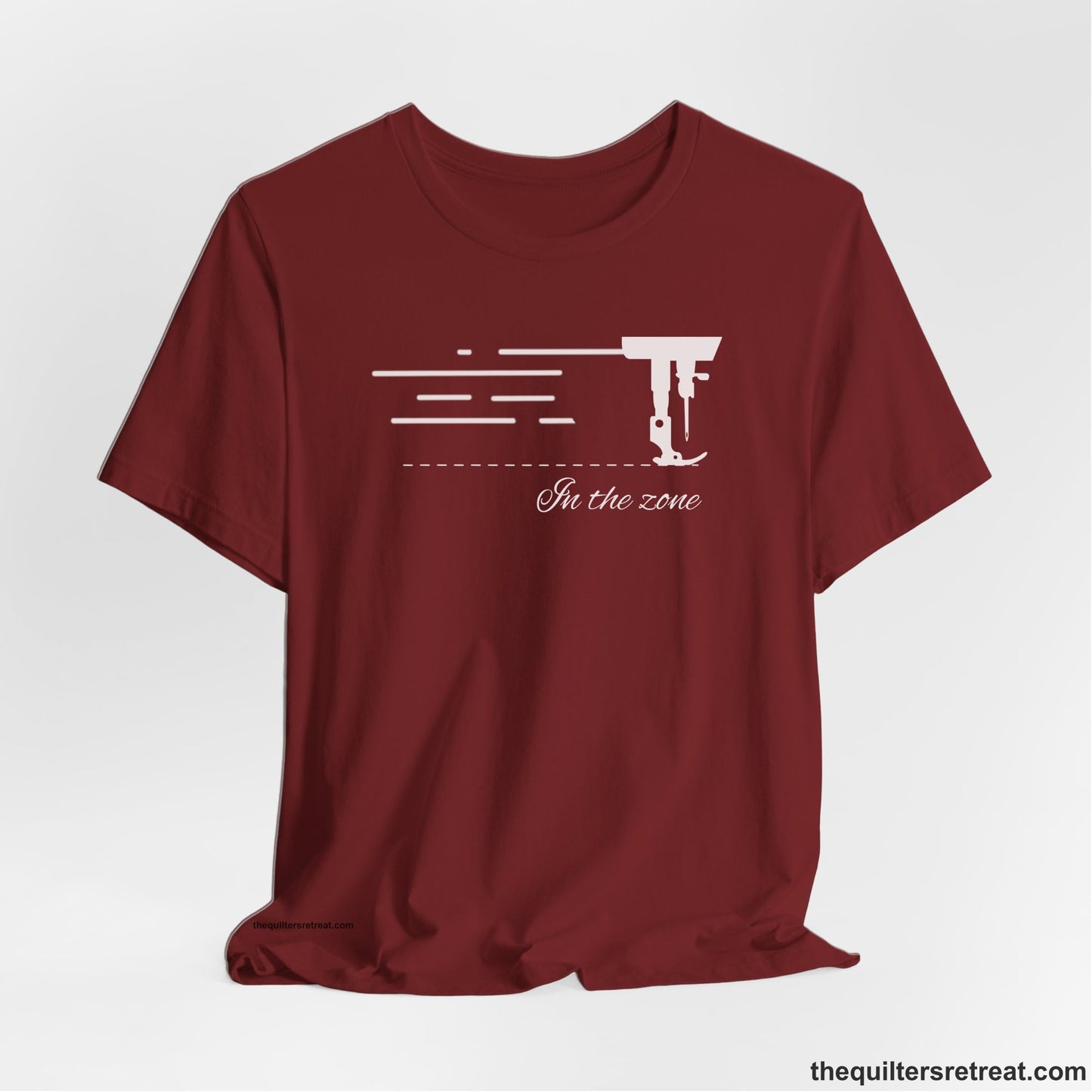 A Cardinal Short Sleeve T-Shirt with a vintage sewing machine illustration with floral accents and "Sewing Mends the Soul" text