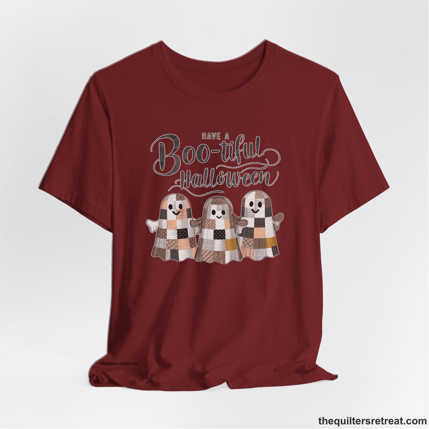 A Cardinal Short Sleeve T-Shirt with a cute patchwork ghosts with "Boo-tiful Halloween" text in a playful style