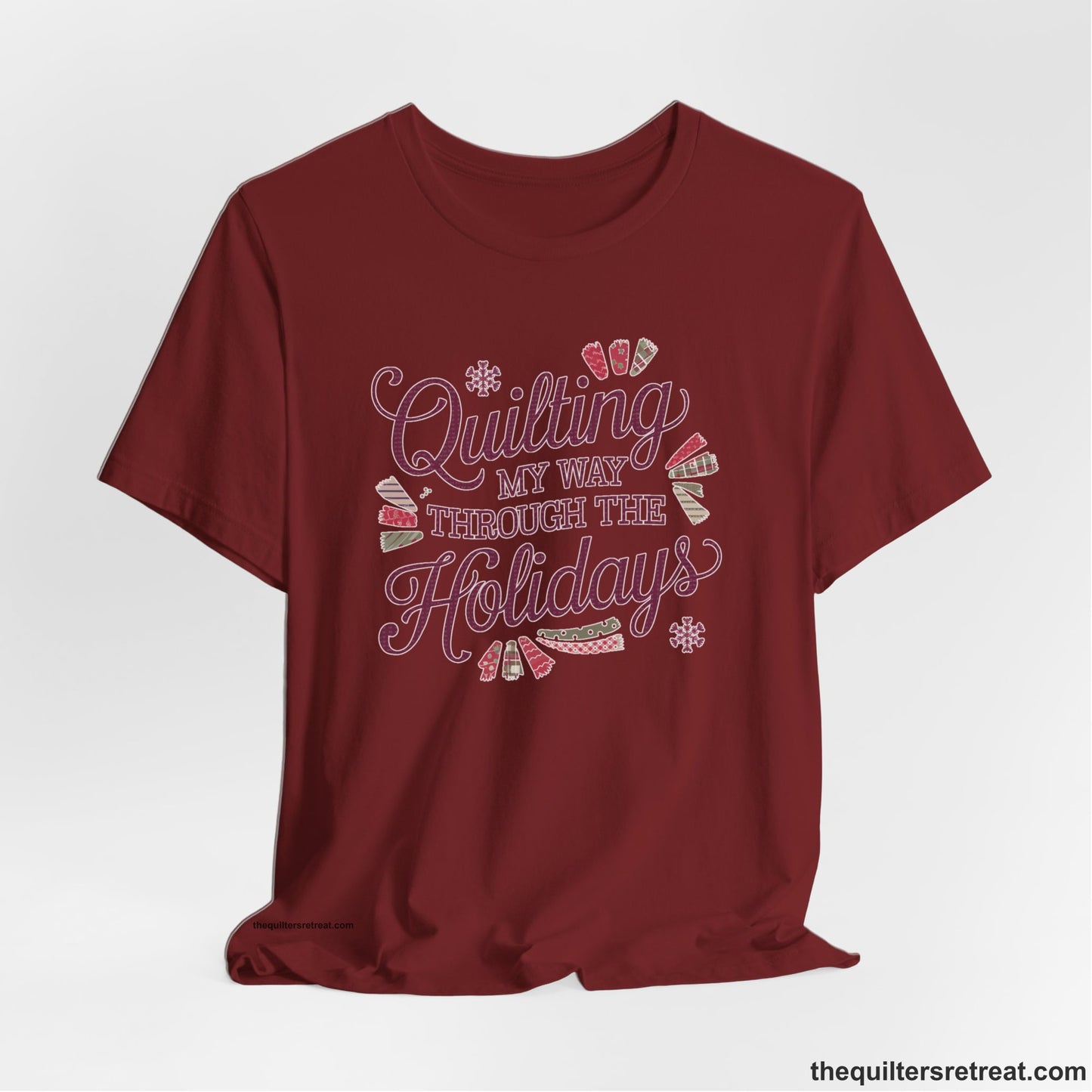A Cardinal Short Sleeve T-Shirt with a quilting-themed text in festive colors with decorative quilt patterns